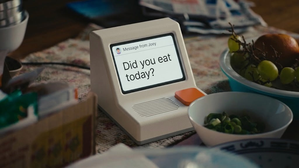 A Memobox on a breakfast table beside bowls of fruit
