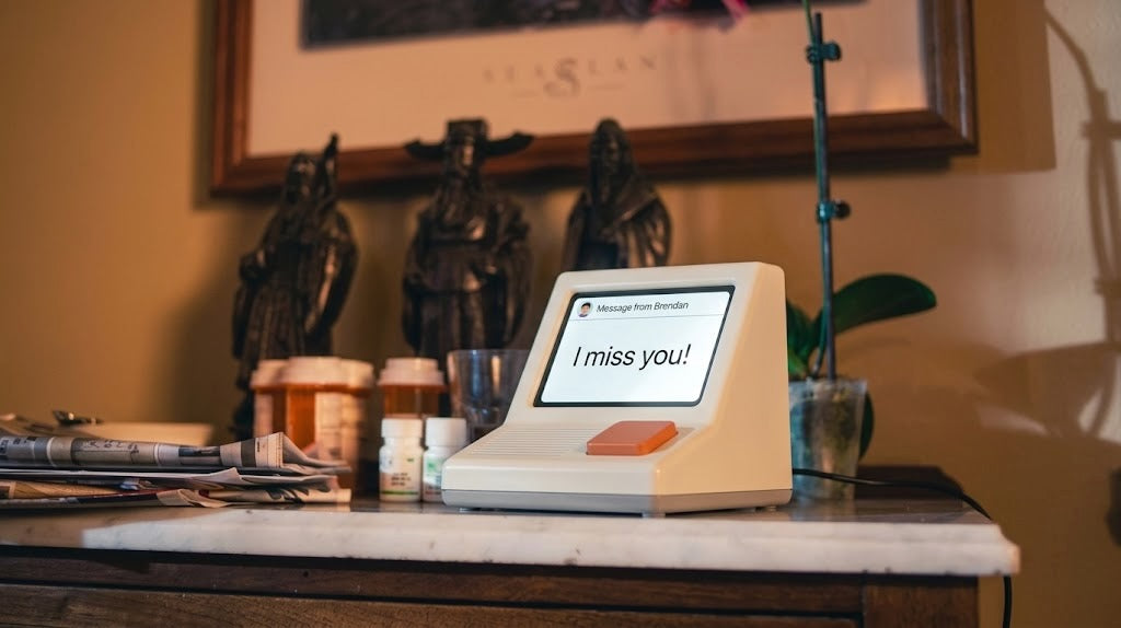 A Memobox on a sideboard beside medication bottles