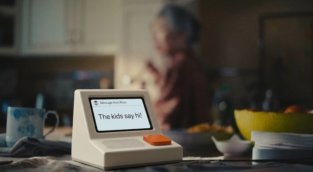 A Memobox on a kitchen table with someone in the background